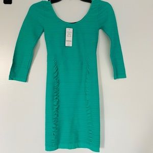 Sexy green BEBE bodycon dress in size small!